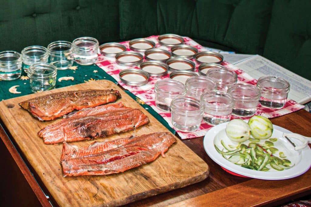 Canning fish aboard a boat.