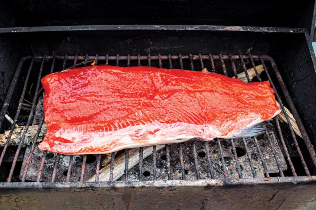 Cooking fish on a grill.