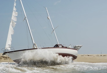sailboat washed up on a beach in Martha's Vineyard