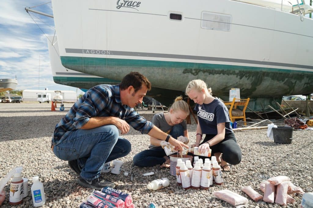 Prepping and painting the bottom of a boat.