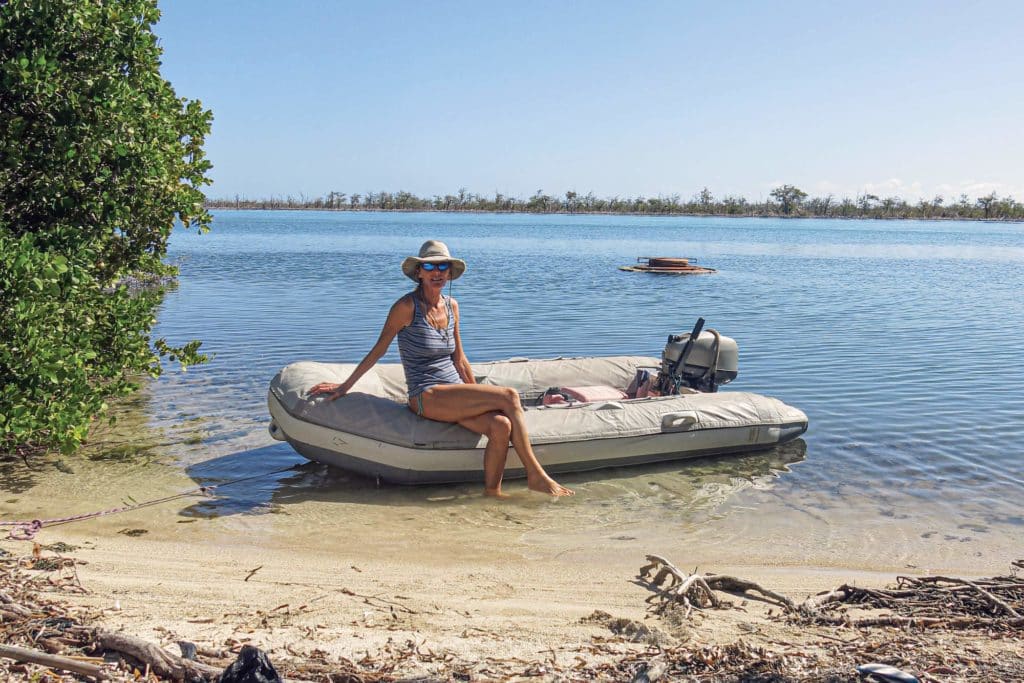 Suzy Carmody sitting on an inflatable boat