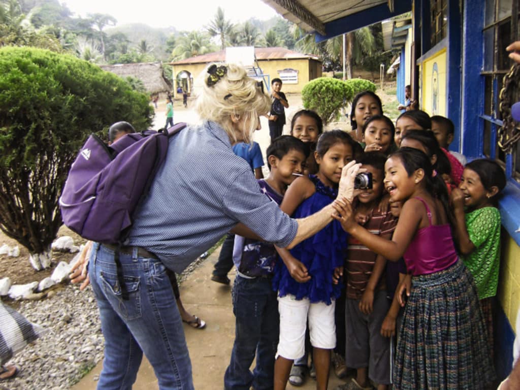 kids in the village getting their pictures taken