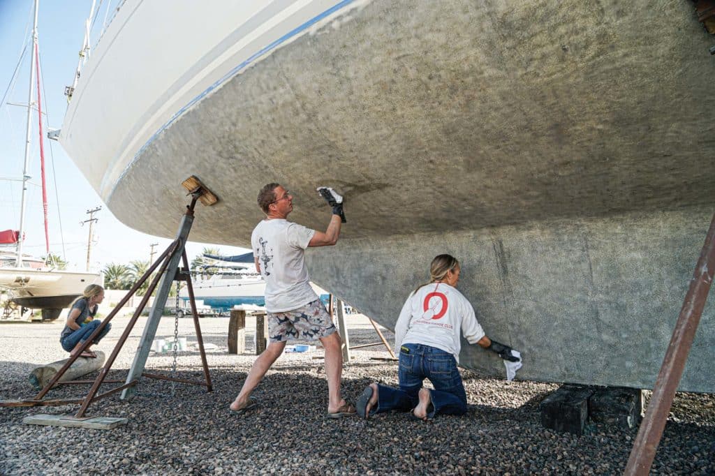 Prepping and painting the bottom of a boat.