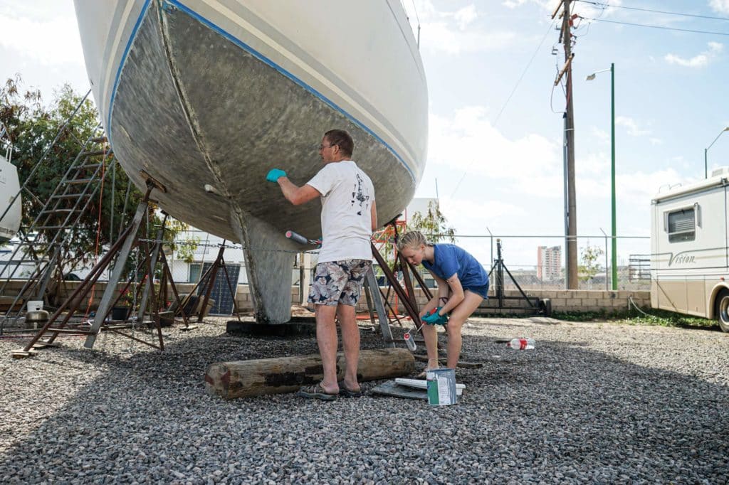 Prepping and painting the bottom of a boat.