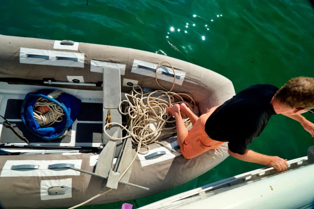 Jamie preps anchor and rode in the dinghy.