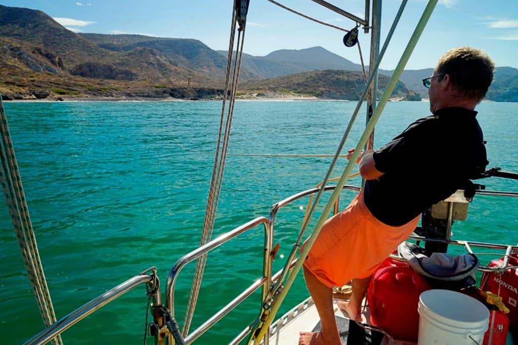 Setting an anchor from a sailboat.