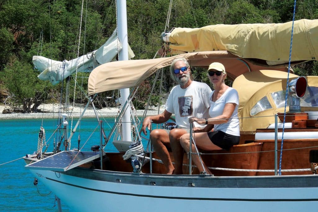 A couple aboard a sailboat