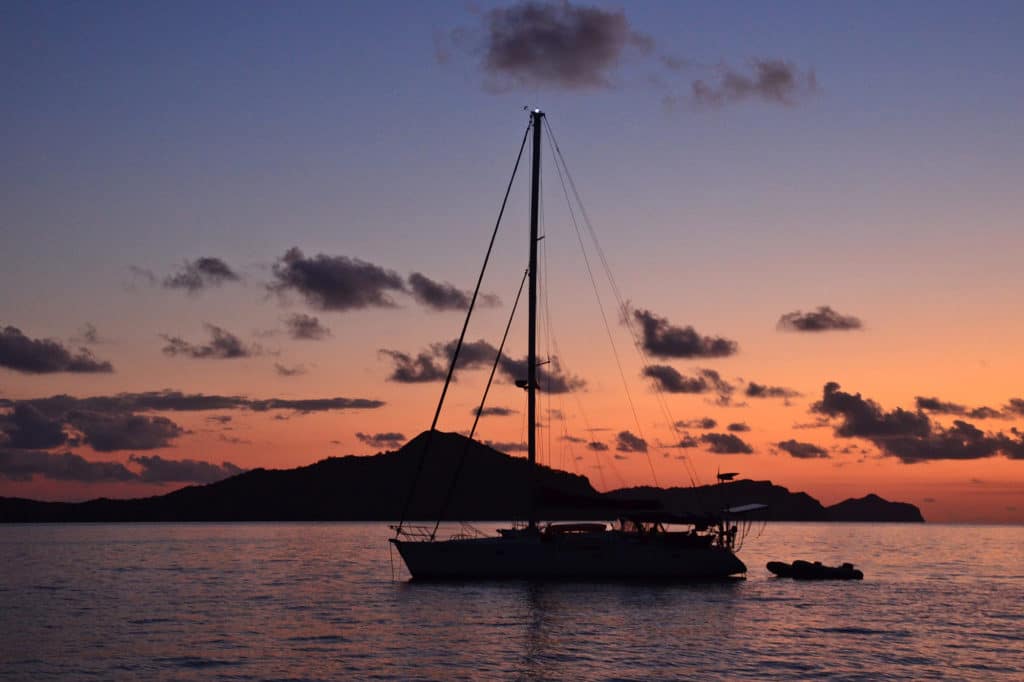 sailboat on the water during sunset