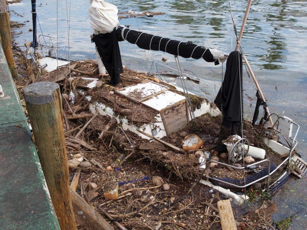 This boat in Coconut Grove, Florida, nearly sank from all the debris.