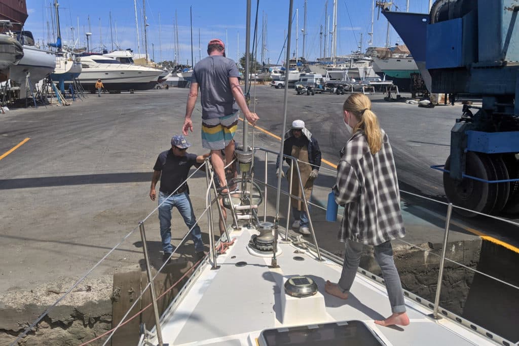 Moving a sailboat onto dry land.