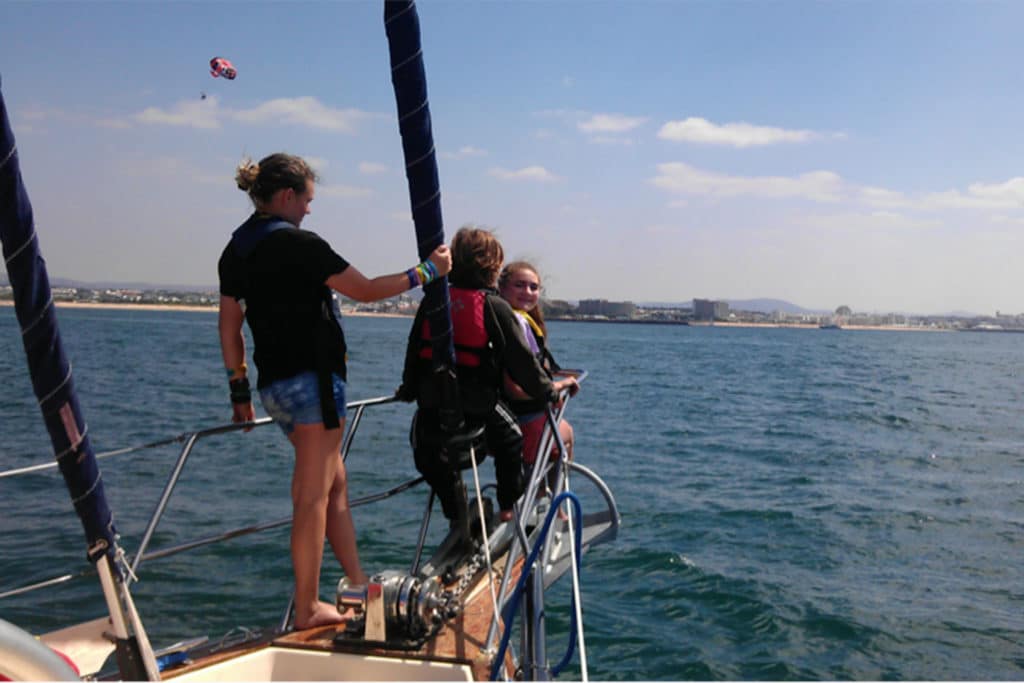 Black family sailing in Portugal