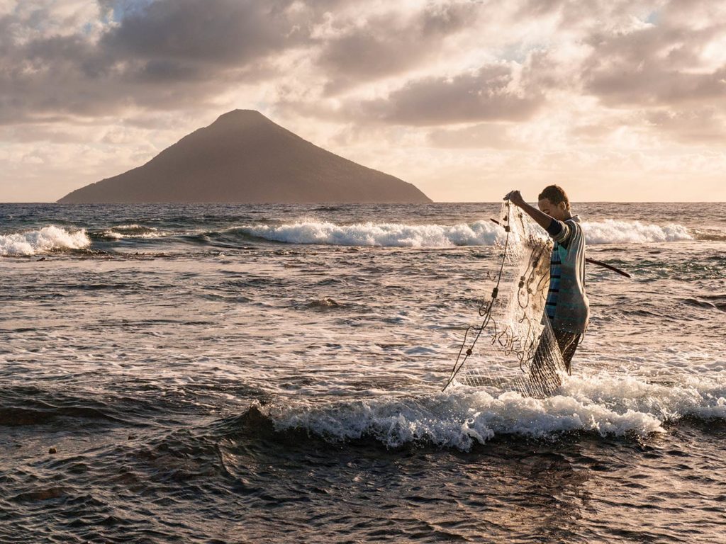 fisherman casting a net