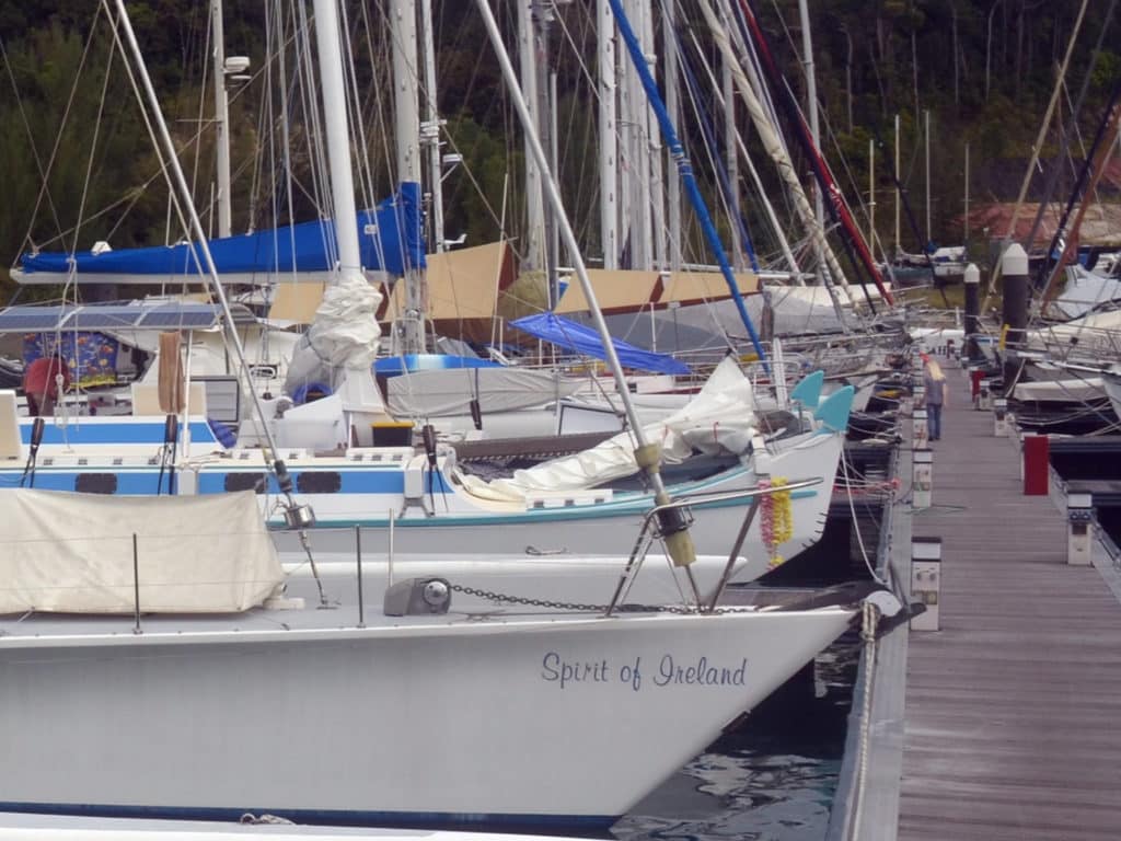 long dock with sailboats pulled up