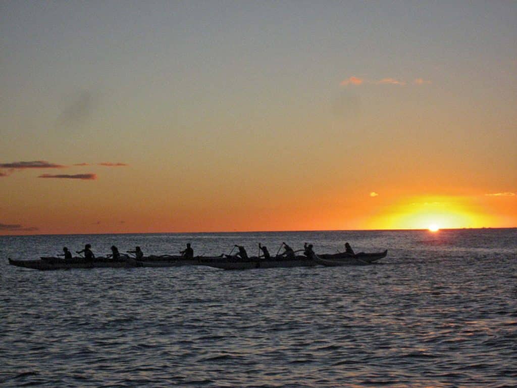 Paddlers at sunset