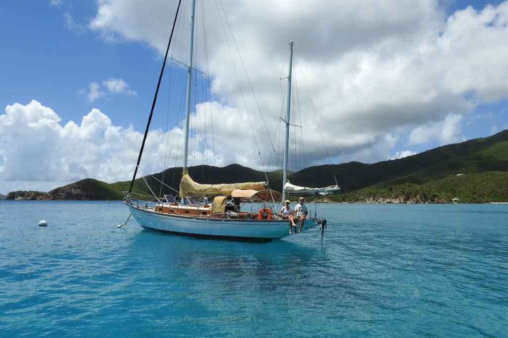 a repaired sailboat floating on the water