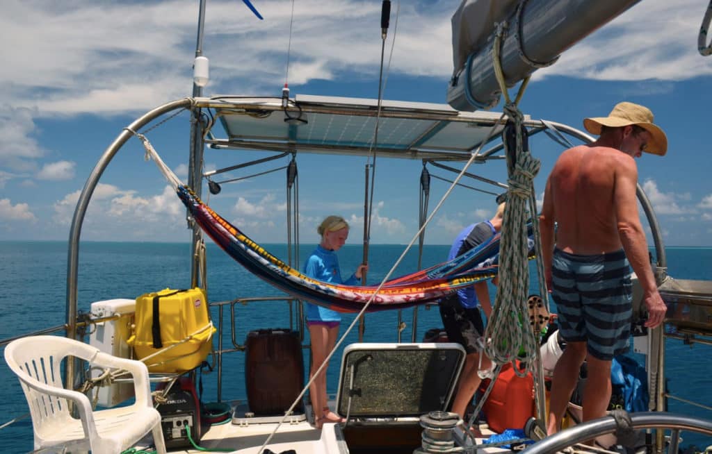 Sailboat deck with a lawn chair found in the ocean