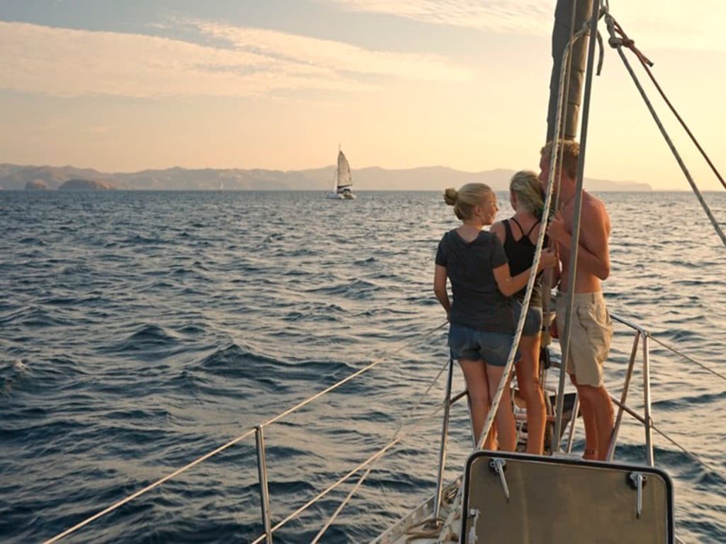 three teens on totem's bow