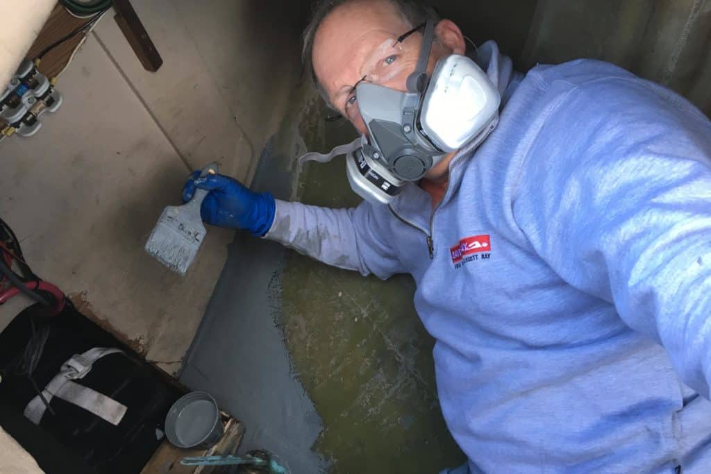 Onne van der Wal works on his sailboat.