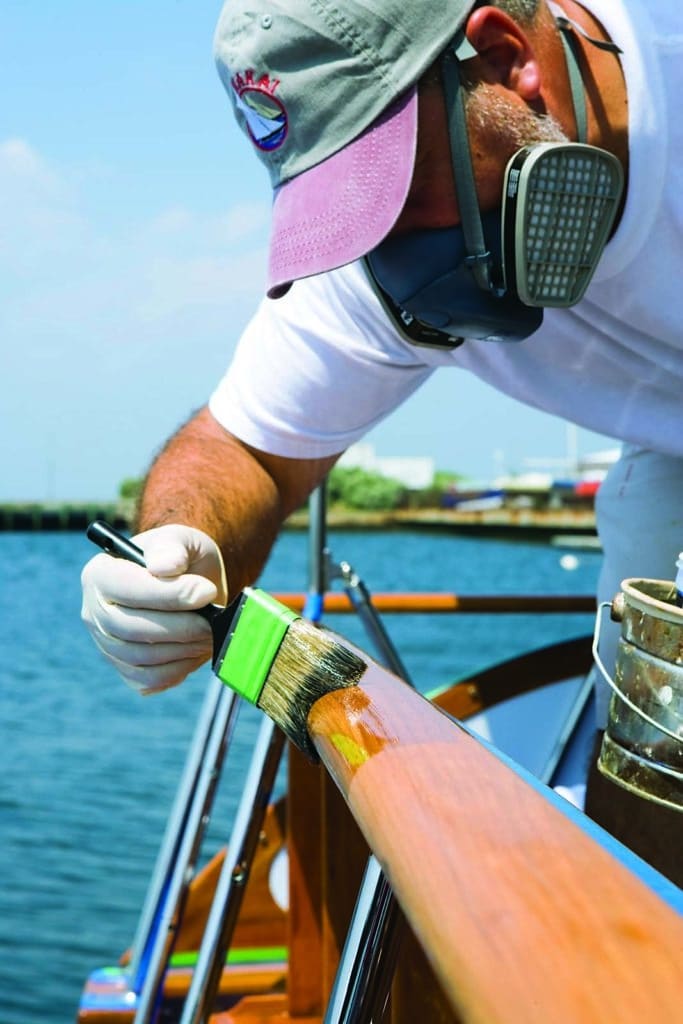 varnishing a sailboat