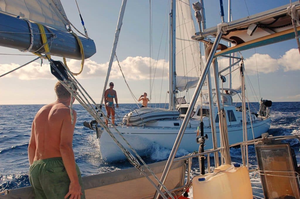 Throwing fish filets between boats