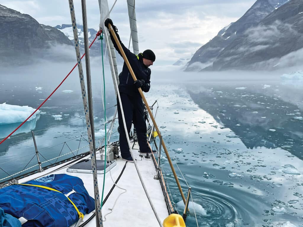 Pole-pushing ice on a sailboat