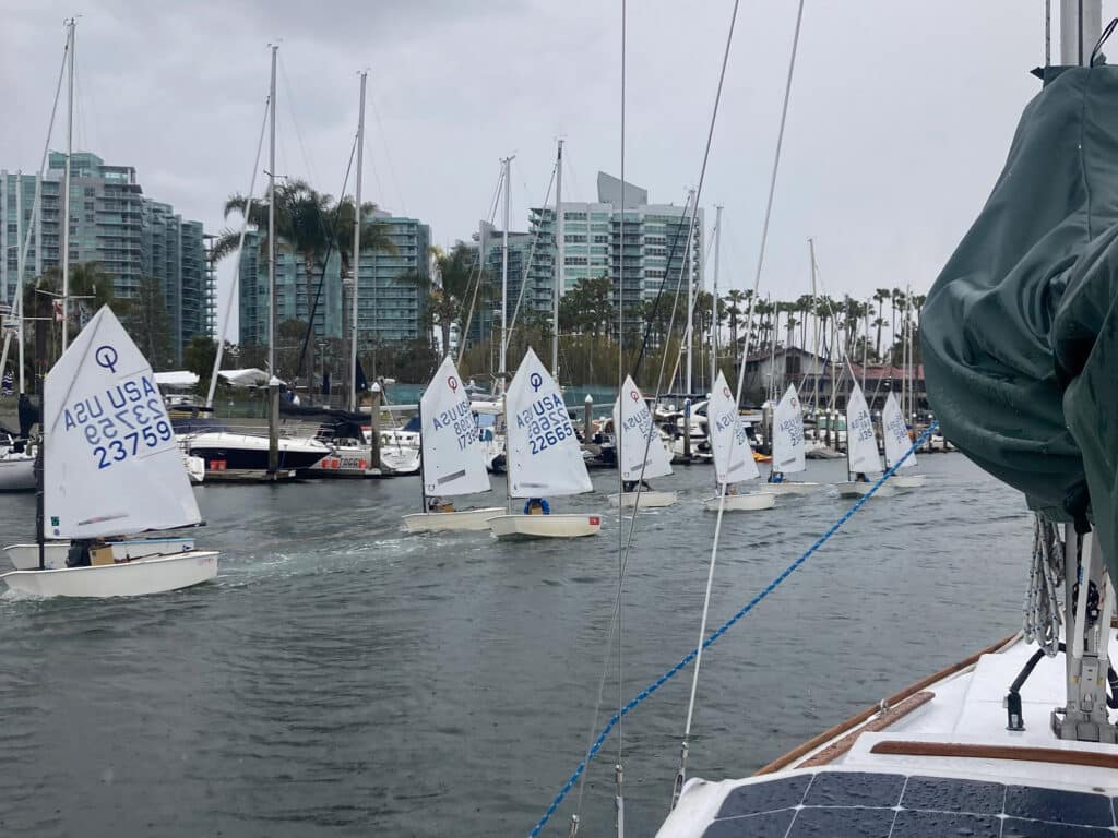 youth sailors getting towed