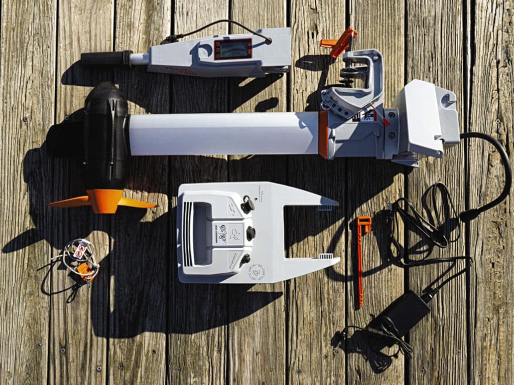 Torqeedo components laid out on a dock