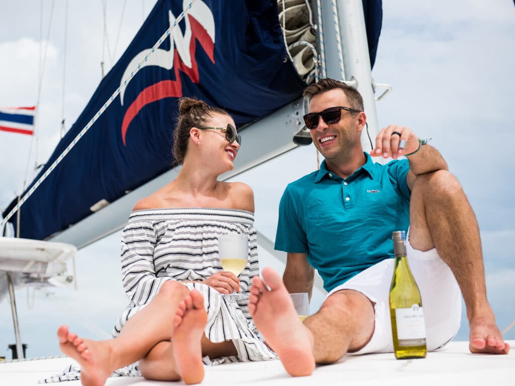 couple on the deck of a catamaran