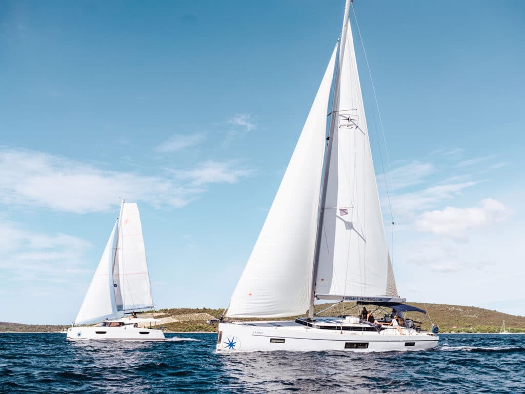 Two sailboats on the water