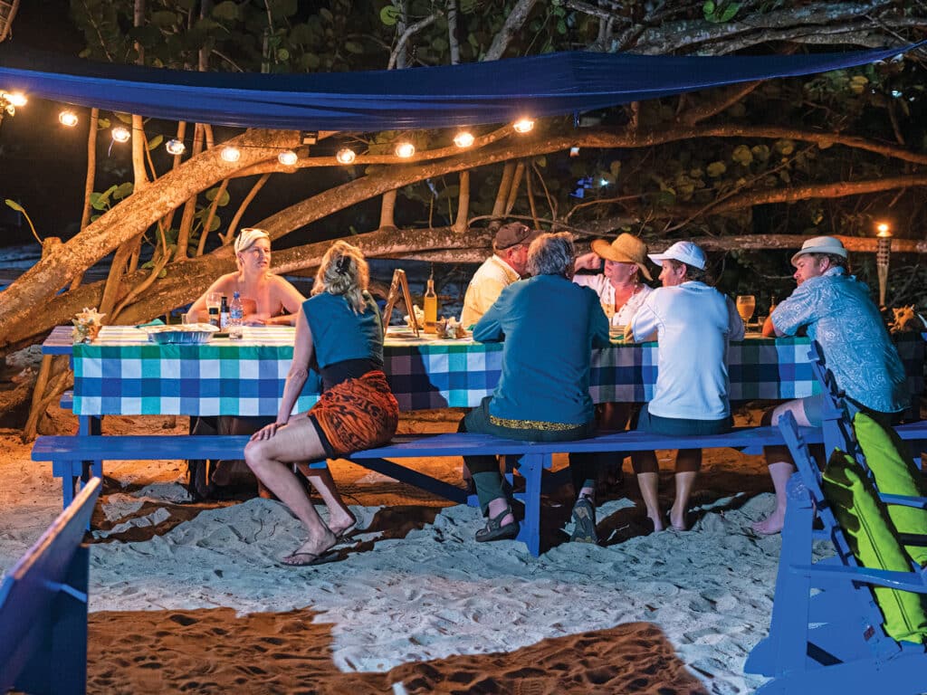 Dinner party on a beach at night