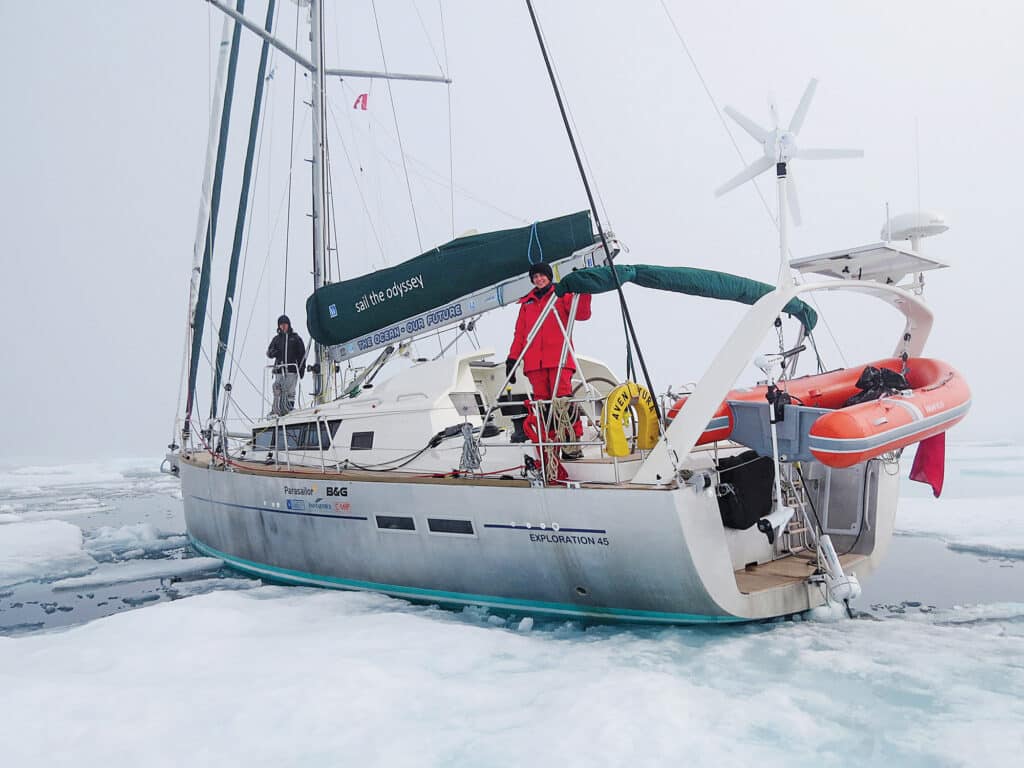 Sailboat going through icy waters