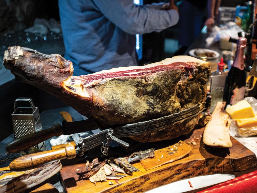 prosciutto being carved