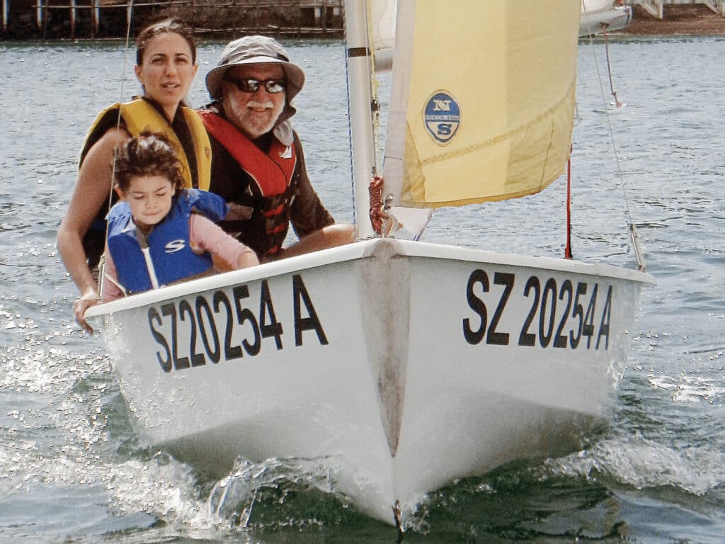 Fatty with family on a dinghy