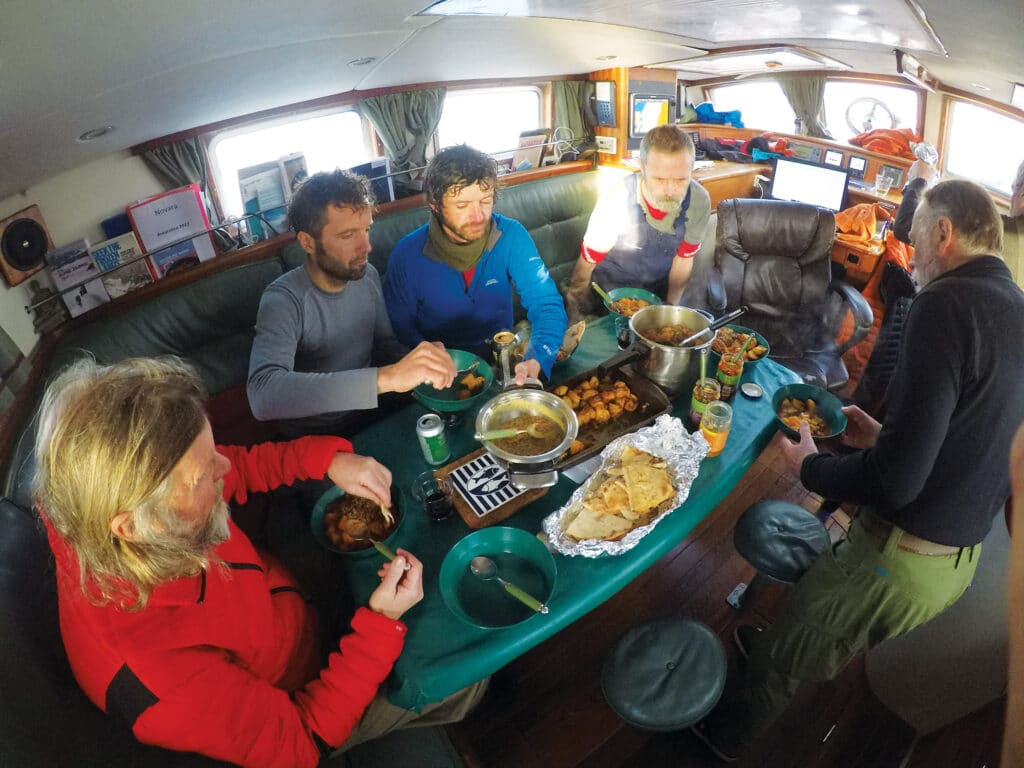 Sailboat crew eating a meal