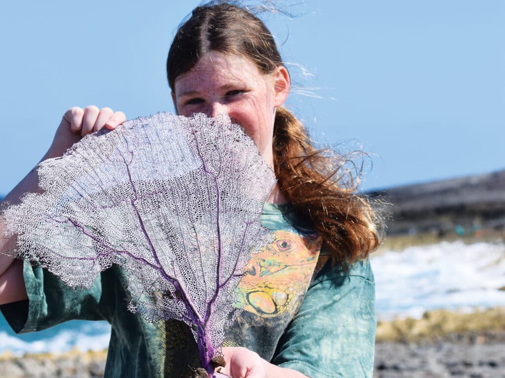 girl holding coral