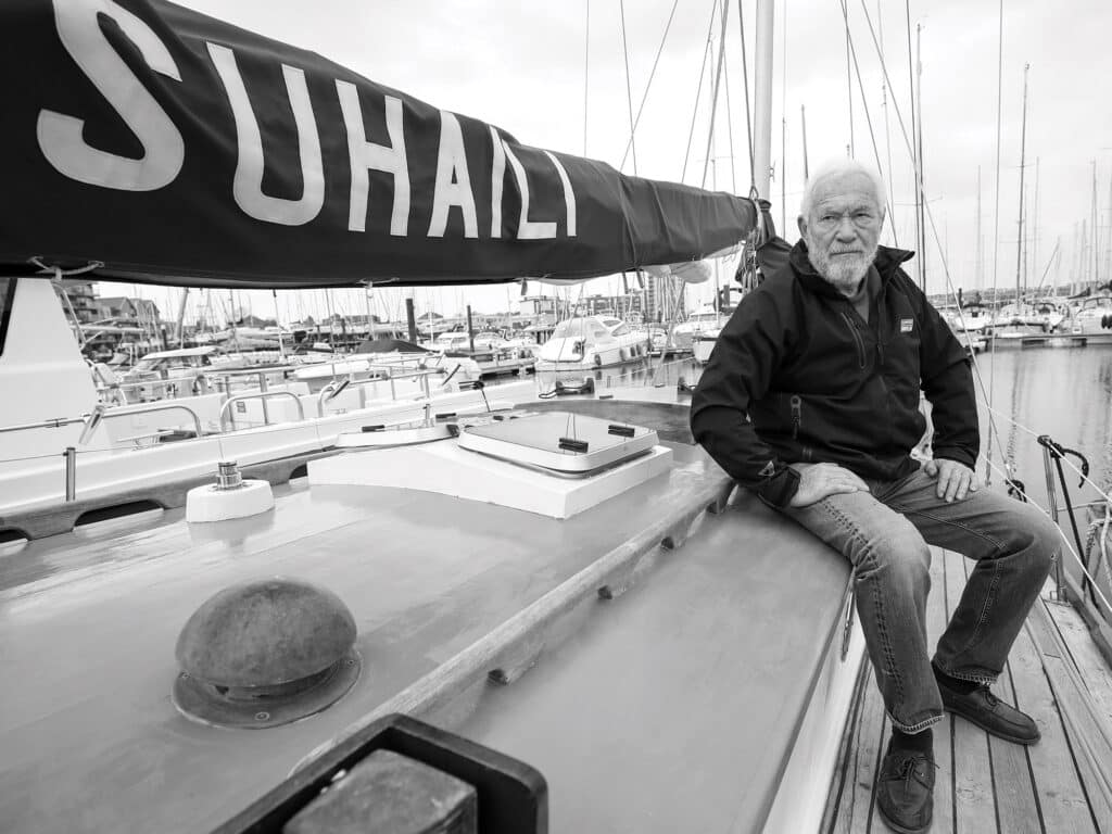 Sir Robin Knox-Johnston on the deck of his boat Suhaili on which he became the first person to sail non stop around the world 50 years ago.