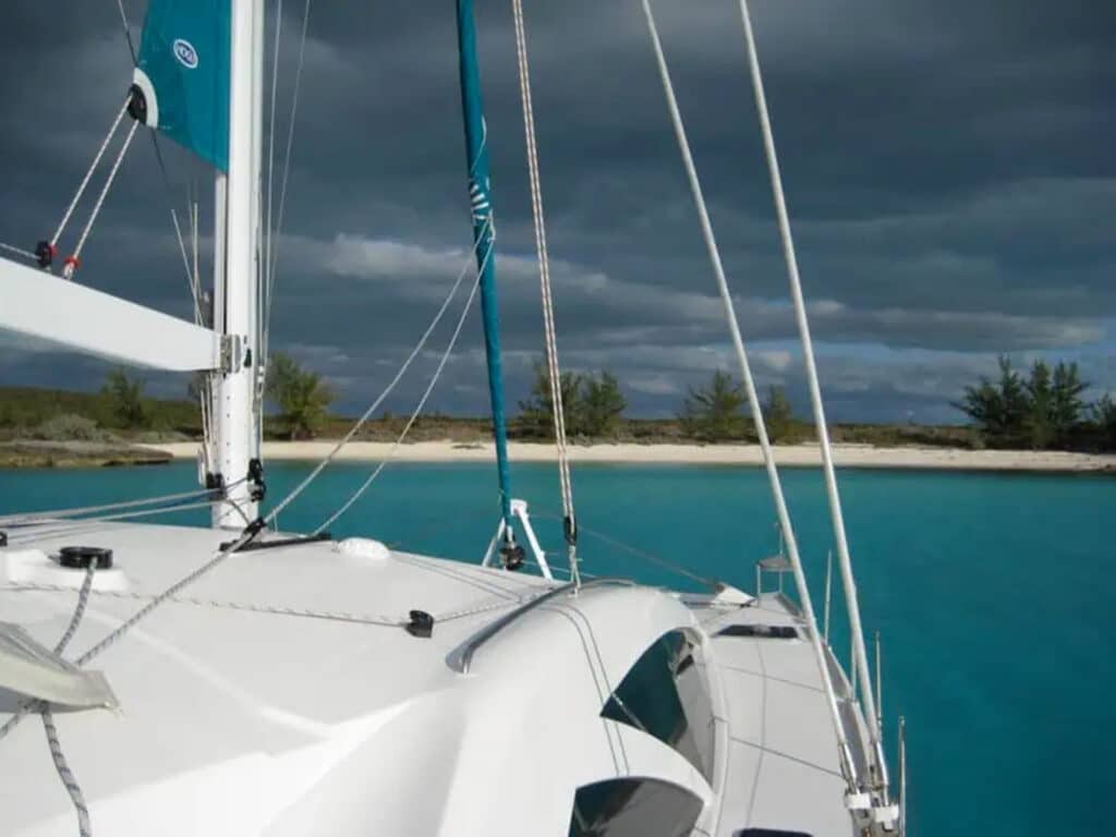 catamaran off the coast of an island in the Bahamas