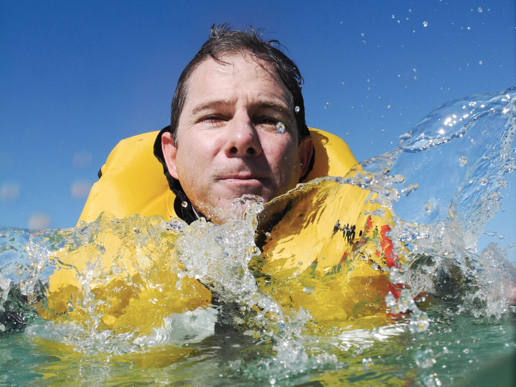 Person in the water is wearing a well-maintained life jacket