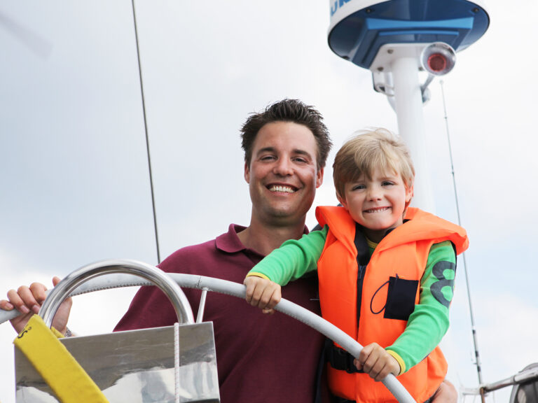 Father and son on a boat