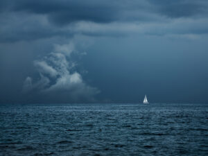 Boat Sailing in Center of Storm Formation