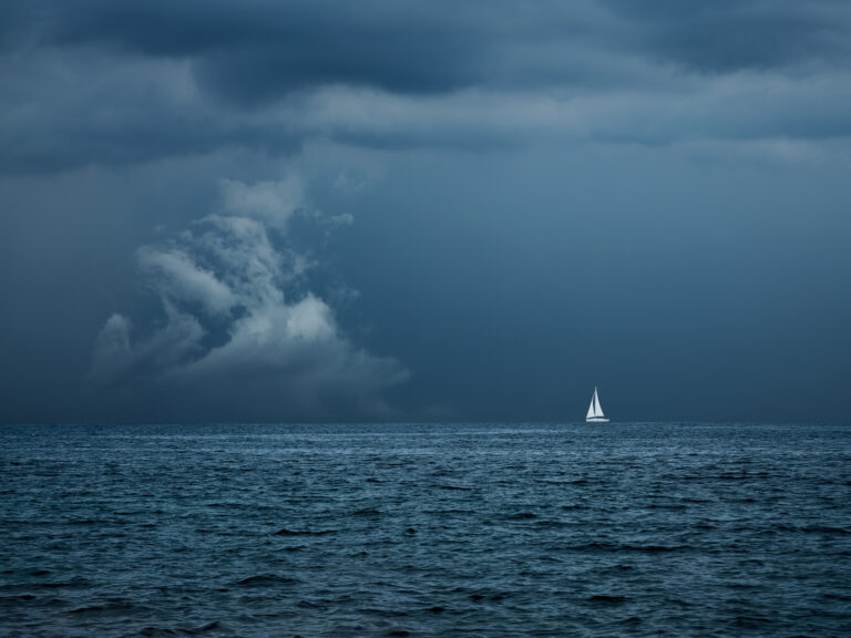 Boat Sailing in Center of Storm Formation