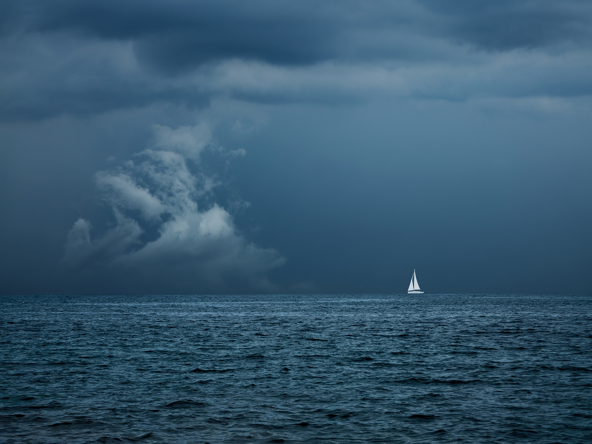 Boat Sailing in Center of Storm Formation