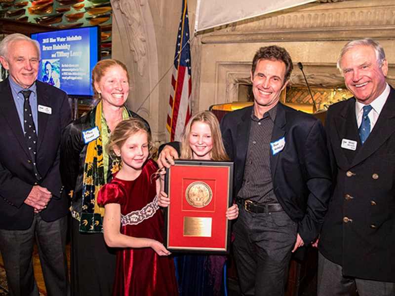 2018 CCA Award Winners Photo © Dan Nerney
The 2018 CCA Blue Water Medalists Tiffany Loney and Bruce Halabisky with their daughters Soliana and Seffa Jane receiving the Blue Water Medal from Awards Chairman Bill Cook and CCA Commodore Brad Willauer at the New York Yacht Club.