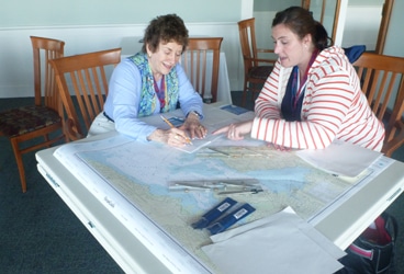 Participants practice the basics of chart plotting to determine the course to their chosen destination.