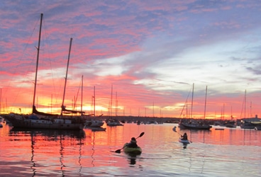 Kayaking San Diego The girls kayaking through the San Diego mooring field near our anchorage.