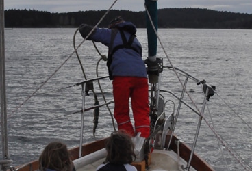 Del Viento- anchoring Most of the time, Windy sets the anchor and snubber on Del Viento while I'm at the helm. Here in Roche Harbor, late afternoon, I noticed the girls up front, watching her like two lion cubs watching their momma take down prey.