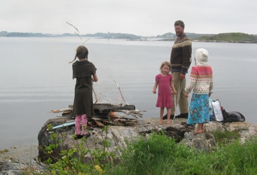 Zartman- girls Building a beach bonfire—heap on the drift wood and watch her go.