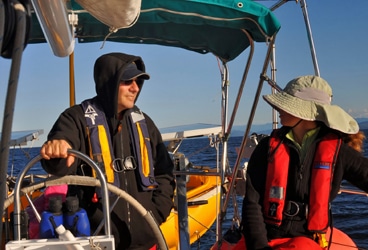 Del Viento- motoring John and Windy motoring in the Strait of Juan de Fuca.
