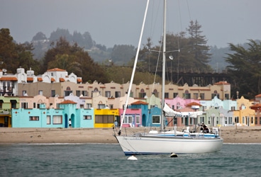 Sailing south from San Francisco Bay, the crew of Zeus, a 39-foot Swan, stopped for lunch at Capitola, listed in the National Register of Historic Places as California's first seaside resort town. The colorful beachside Venetian Court Apartments underscore the town's long association with tourism.