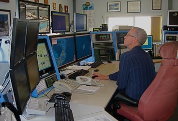Bermuda Radio Martin Williams, the duty officer at Bermuda Radio, presides over the array of VHFs, SSBs, and computer monitors that watch and listen to everything happening to boats within a 200-mile radius of the island.